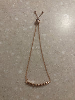 Load image into Gallery viewer, Kate Spade Rose Gold Full Circle Rhinestone Slider Bolo Bracelet
